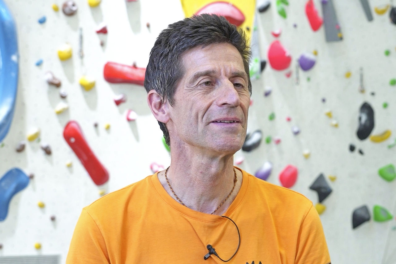 A photo of Roland answering interview questions