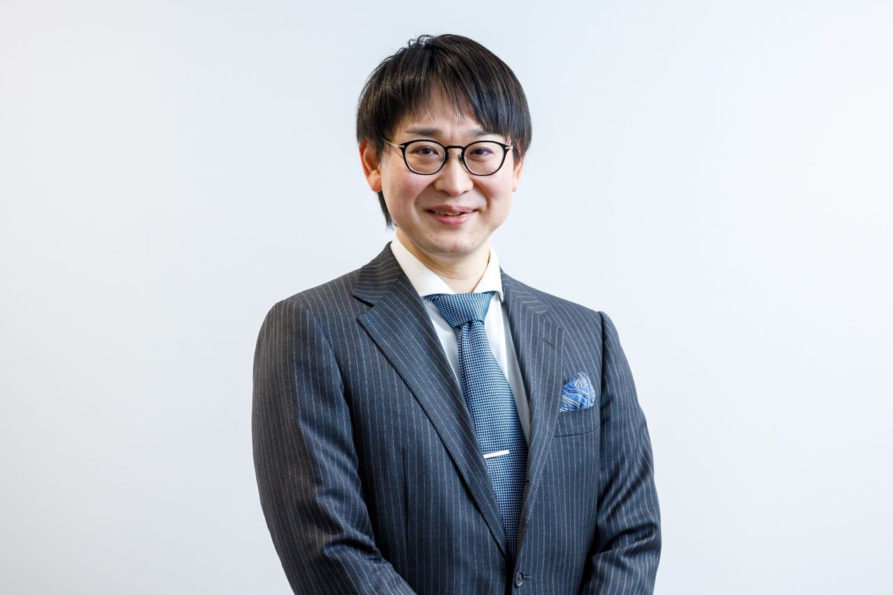 A photo of Takayuki smiling